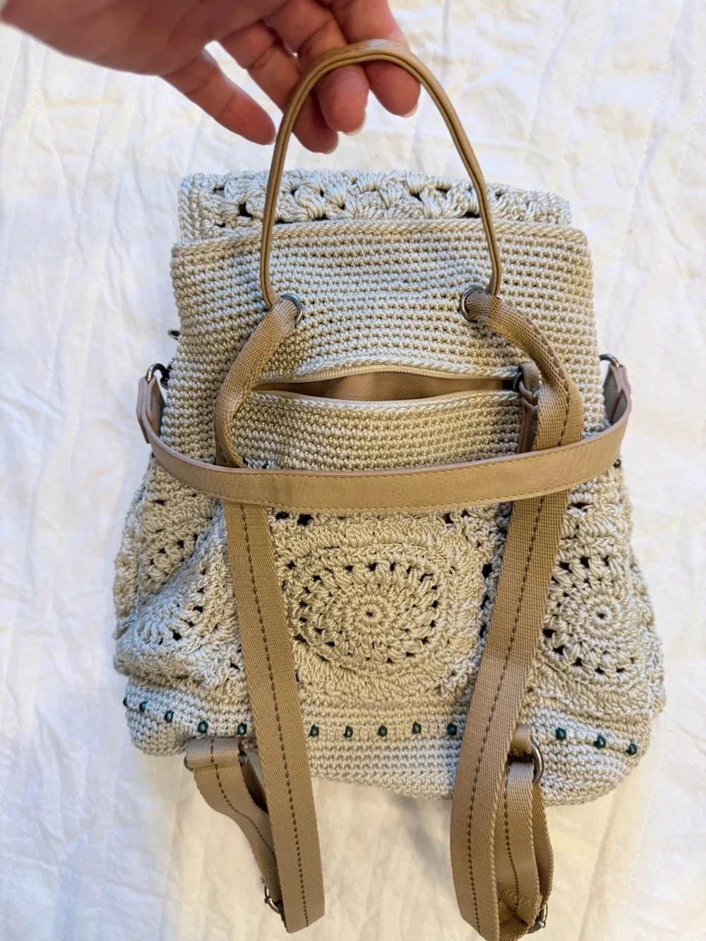 The Sak Crochet-Style Backpack in Light Beige with Tan Handle